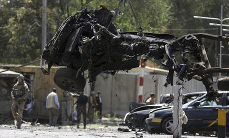 Resolute Support (RS) forces remove a destroyed vehicle after a car bomb explosion in Kabul, Afghanistan, Thursday, Sept. 5, 2019. Resolute Support (RS) forces remove a destroyed vehicle after a car bomb explosion in Kabul, Afghanistan, Thursday, Sept. 5, 2019.