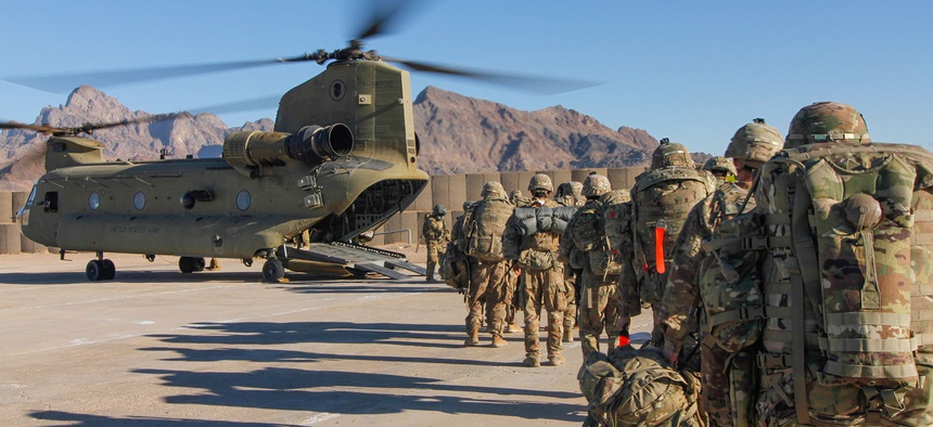 Soldiers assigned to the 101st Resolute Support Sustainment Brigade load onto a Chinook helicopter to head out and execute missions across Afghanistan, Jan. 15, 2019.
