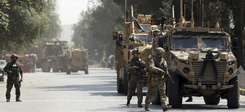 Resolute Support forces arrive at the site of a car bomb explosion in Kabul, Afghanistan, near the U.S. Embassy and other diplomatic missions, Thursday, Sept. 5, 2019.