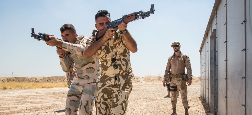 Iraqi Security Force (ISF) soldiers practice movement techniques in an urban environment as part of a combat training exercise at the Besmaya Range Complex, Iraq, July 8, 2019.