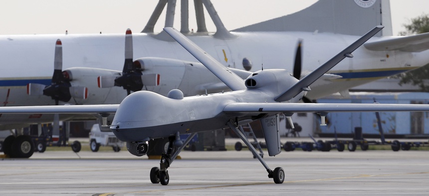 A Predator B unmanned aircraft taxis at the Naval Air Station, Tuesday, Nov. 8, 2011, in Corpus Christi, Texas.