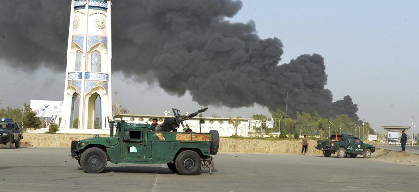 Afghan security forces arrive after a powerful explosion outside the provincial police headquarters in Kandahar province south of Kabul, Afghanistan, Thursday, July 18, 2019.