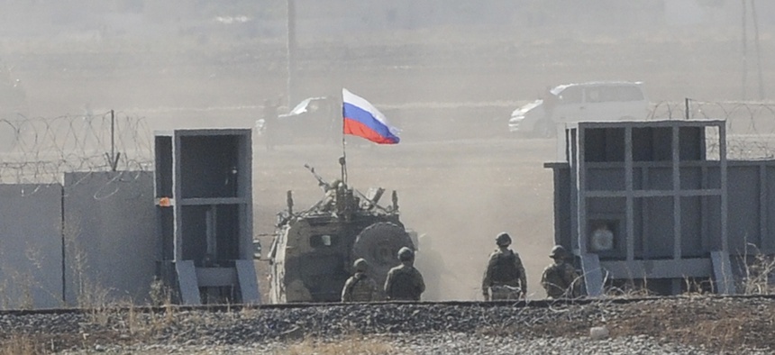 In this photo taken from the outskirts of Suruc, southeastern Turkey, Russian and Turkish forces enter Syria, as they begin their joint patrol, Tuesday, Nov. 5, 2019.