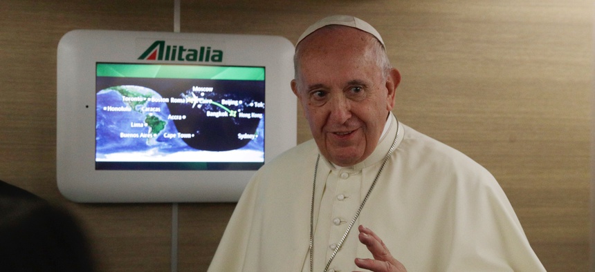 Pope Francis greets the journalists aboard the papal plane heading to Bangkok on the occasion of the pontiff eight-day trip to Thailand and Japan, Tuesday, Nov. 19, 2019.
