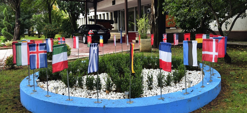 On Nov. 11, 2019, the NATO flag, center, and flags of member countries wave in front of the Montenegrin Defense Ministry in Podgorica, Montenegro.