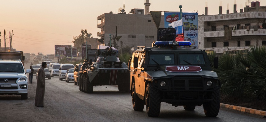 Russian forces patrol in the city of Amuda, north Syria, Thursday, Oct. 24, 2019.