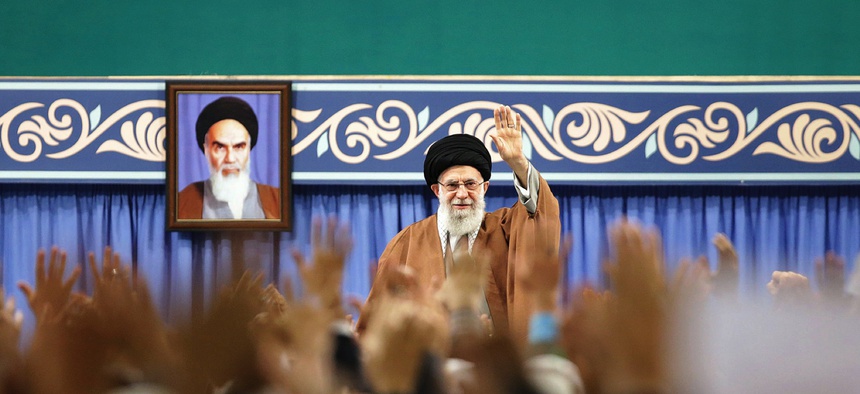 In this picture released by the official website of the office of the Iranian supreme leader, Supreme Leader Ayatollah Ali Khamenei waves to members of the Revolutionary Guard's all-volunteer Basij force in a meeting in Tehran on Nov. 27, 2019.