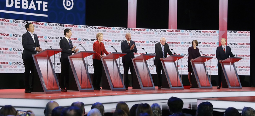 Democratic presidential candidates from left, entrepreneur Andrew Yang, South Bend Mayor Pete Buttigieg, Sen. Elizabeth Warren, D-Mass., former Vice President Joe Biden, Sen. Bernie Sanders, I-Vt., Sen. Amy Klobuchar, D-Minn., and businessman Tom Steyer.