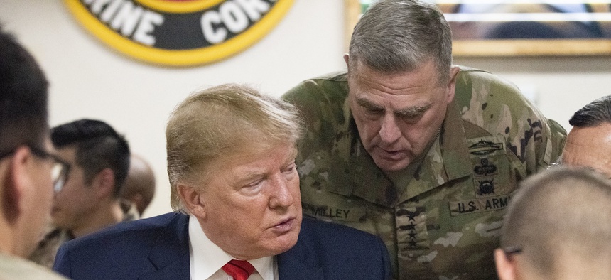 President Donald Trump and Gen. Mark Milley, chairman of the Joint Chiefs of Staff, meet with service members at Bagram Airfield in Afghanistan, Nov. 28, 2019.