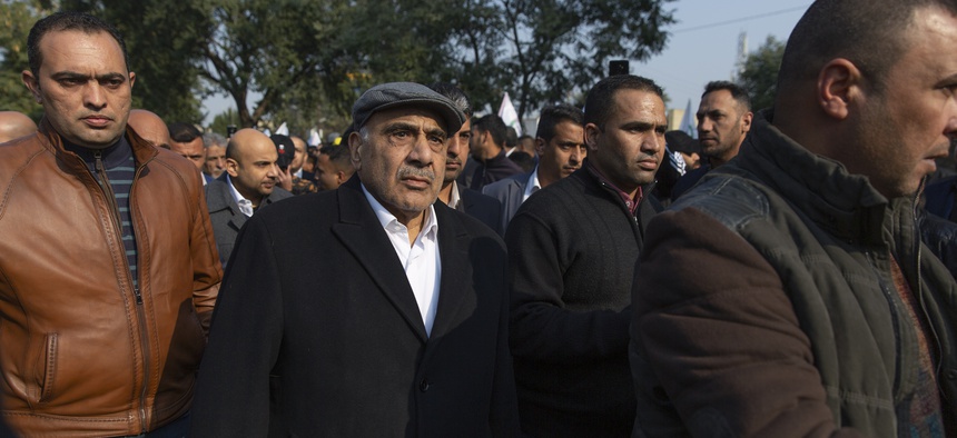 Iraqi acting Prime Minister Adil Abdul-Mahdi takes part in the funeral of Iran's top general Qassem Soleimani and Abu Mahdi al-Muhandis, deputy commander of Iran-backed militias in Iraq known as the Popular Mobilization Forces, in Baghdad, Iraq, Saturday,