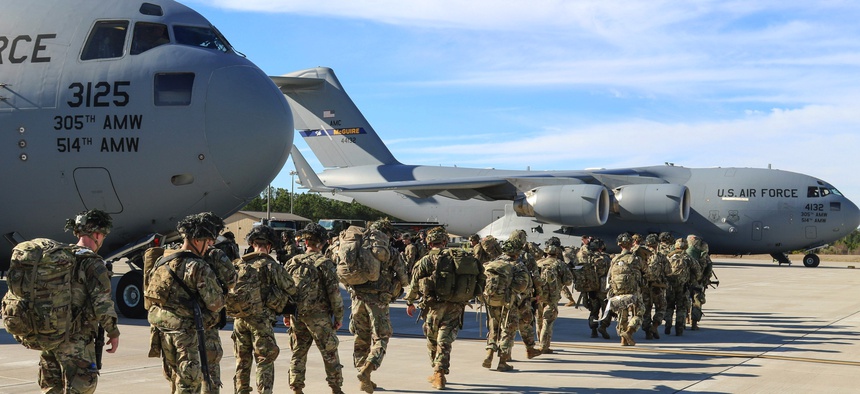 Army paratroopers assigned to the 2nd Battalion, 504th Parachute Infantry Regiment deploy from Pope Army Airfield, N.C., Jan. 1, 2020.