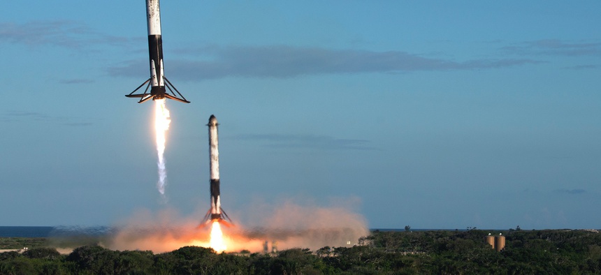 Two reusable rocket boosters land after the successful launch of SpaceX's Falcon Heavy Arabsat 6A on April 12, 2019, at Kennedy Space Center, Fla.