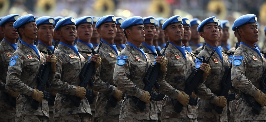 Chinese United Nations (UN) peacekeeping forces march in formation during a parade to commemorate the 70th anniversary of the founding of Communist China in Beijing, Tuesday, Oct. 1, 2019.