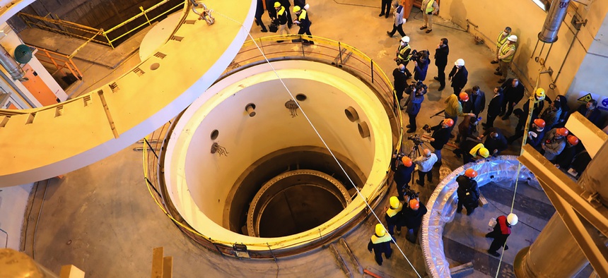 Technicians work at the Arak heavy water reactor's secondary circuit, as officials and media visit the site, near Arak, 150 miles (250 kilometers) southwest of the capital Tehran, Iran, Monday, Dec. 23, 2019.