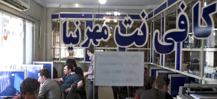 Iranians surf the Internet at a cafe in Tehran, Iran, Tuesday, Sept, 17, 2013. The joy of Iran's Facebook and Twitter fans was short-lived as authorities on Tuesday restored blocks on social networks after filters were lifted for several hours overnight.