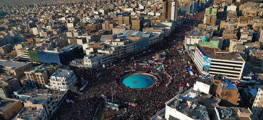 In this aerial photo released by the Iranian government, mourners attend a funeral ceremony for Iranian Gen. Qassem Soleimani and his comrades, who were killed in Iraq in a U.S. drone strike on Friday, in Tehran, Iran, Monday, Jan. 6, 2020.