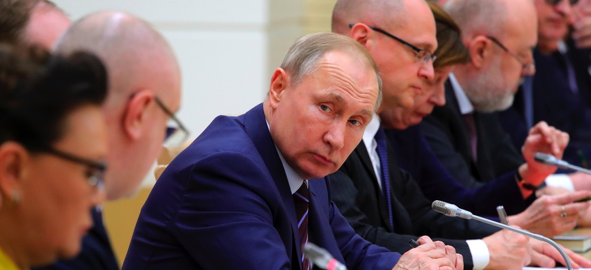 Russian President Vladimir Putin attends a meeting on drafting constitutional changes at the Novo-Ogaryovo residence outside Moscow, Russia, Thursday, Jan. 16, 2020.