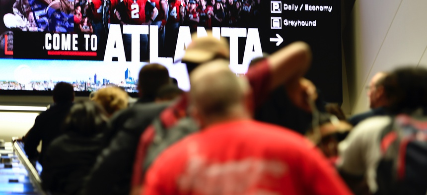 Travelers move in Hartsfield-Jackson Atlanta International Airport , Monday, Sept. 9, 2019, in Atlanta.