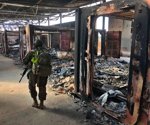 U.S. Soldiers walk past a site of Iranian bombing at Ain al-Asad air base, in Anbar, Iraq, Monday, Jan. 13, 2020 U.S. Soldiers walk past a site of Iranian bombing at Ain al-Asad air base, in Anbar, Iraq, Monday, Jan. 13, 2020