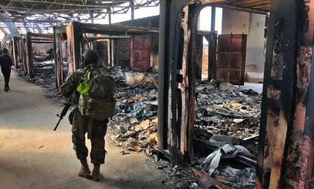U.S. Soldiers walk past a site of Iranian bombing at Ain al-Asad air base, in Anbar, Iraq, Monday, Jan. 13, 2020 U.S. Soldiers walk past a site of Iranian bombing at Ain al-Asad air base, in Anbar, Iraq, Monday, Jan. 13, 2020