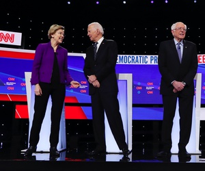 Democratic presidential candidates stand on stage, Tuesday, Jan. 14, 2020, before a Democratic presidential primary debate hosted by CNN and the Des Moines Register in Des Moines, Iowa.
