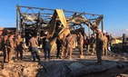 U.S. soldiers stand at a site of Iranian bombing at Ain al-Asad air base in Anbar, Iraq, Monday, Jan. 13, 2020. U.S. soldiers stand at a site of Iranian bombing at Ain al-Asad air base in Anbar, Iraq, Monday, Jan. 13, 2020.