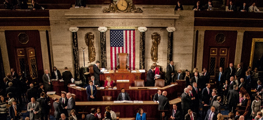 January 3, 2017: Members of the 115th congress and their familes mingle on the house floor while attending the joint session on the opening day of the session.