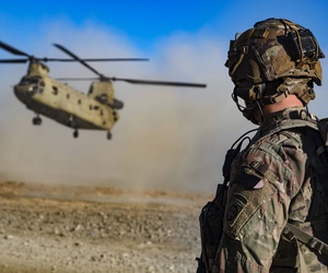 Army Staff Sgt. Jason N. Bobo watches as a CH-47 Chinook prepares to land to provide transport for U.S. and Afghan soldiers after a key leader engagement in southeastern Afghanistan, Dec. 29, 2019. Army Staff Sgt. Jason N. Bobo watches as a CH-47 Chinook prepares to land to provide transport for U.S. and Afghan soldiers after a key leader engagement in southeastern Afghanistan, Dec. 29, 2019.