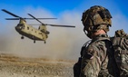 Army Staff Sgt. Jason N. Bobo watches as a CH-47 Chinook prepares to land to provide transport for U.S. and Afghan soldiers after a key leader engagement in southeastern Afghanistan, Dec. 29, 2019. Army Staff Sgt. Jason N. Bobo watches as a CH-47 Chinook prepares to land to provide transport for U.S. and Afghan soldiers after a key leader engagement in southeastern Afghanistan, Dec. 29, 2019.