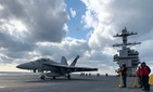 Crews ready an F/A-18 Super Hornet for take off on the deck of USS Gerald R. Ford on Monday Jan. 27. Crews ready an F/A-18 Super Hornet for take off on the deck of USS Gerald R. Ford on Monday Jan. 27.