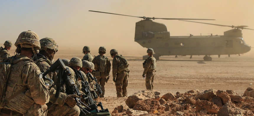Soldiers assigned to the 1st Squadron, 3rd Cavalry Regiment, await extraction via a CH-47 Chinook during an aerial response force live-fire training exercise, Al Asad Air Base, Iraq, Oct. 31, 2018.