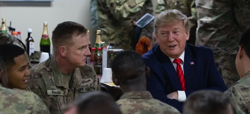 President Donald Trump speaks with members of the military during a surprise Thanksgiving Day visit, Thursday, Nov. 28, 2019, at Bagram Air Field, Afghanistan.