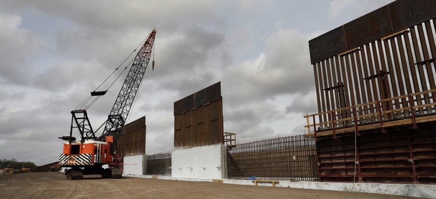 Construction crews work to erect levee wall system in a remote area south of Weslaco, Texas in the U.S. Border Patrol’s Rio Grande Valley Sector. Jan. 13, 2020.