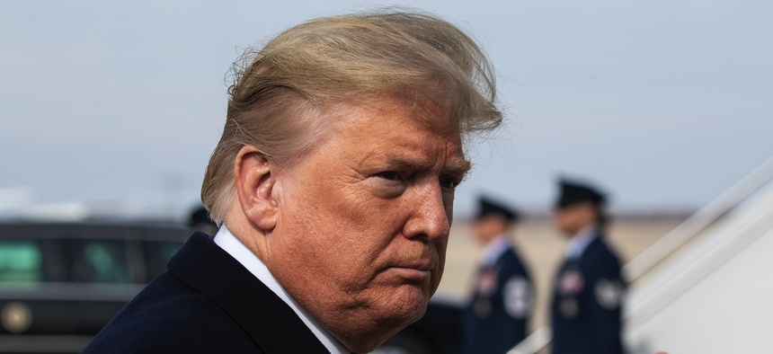 President Donald Trump gives thumbs up after speaking with the media as he boards Air Force One as he departs Tuesday, Feb. 18, 2020, at Andrews Air Force Base, Md.