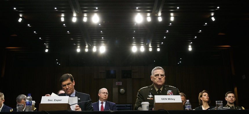 Defense Secretary Mark Esper, left, and Chairman of the Joint Chiefs of Staff Gen. Mark Milley, listen during a Senate Armed Services Committee on budget posture, Wednesday, March 4, 2020, on Capitol Hill in Washington.