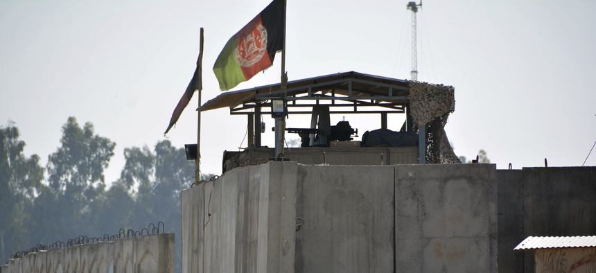 An Afghan security personnel stand guard in the checkpoint of airport after a suicide attack in Jalalabad province, east of Kabul, Afghanistan, Wednesday, March 6, 2019. Militants in Afghanistan set off a suicide blast.