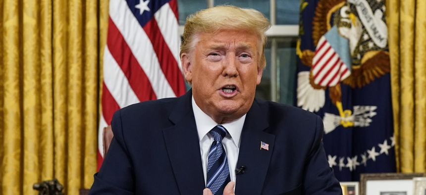 President Donald Trump speaks in an address to the nation from the Oval Office at the White House about the coronavirus Wednesday, March, 11, 2020, in Washington.