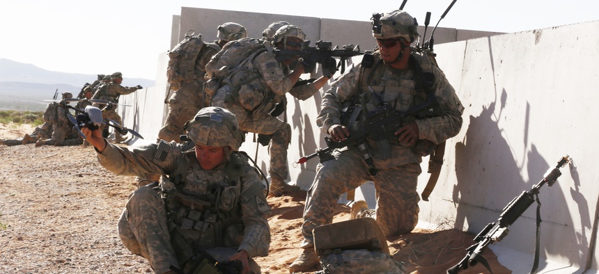 A soldier assigned to 1st Battalion, 1st Infantry Regiment, 2nd Brigade Combat Team sets an unmanned observer drone during NIE 16.2 in May 2016 at Fort Bliss, Texas.