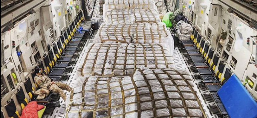 This photo was posted with the caption: "Got to be part of something special last night. These pallets right here are 500,000 covid-19 testing kits that the aircrew I was a part of…” The post has since been taken down.
