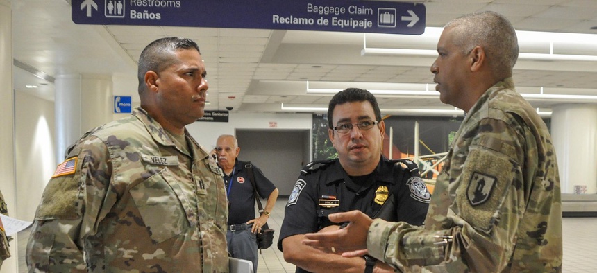 Puerto Rico National Guard and local law enforcement helped establish the action plan to be taken with passengers arriving at Luis Muñoz Marín International Airport in Carolina, Puerto Rico, to detect any suspected cases of COVID-19, March 16.