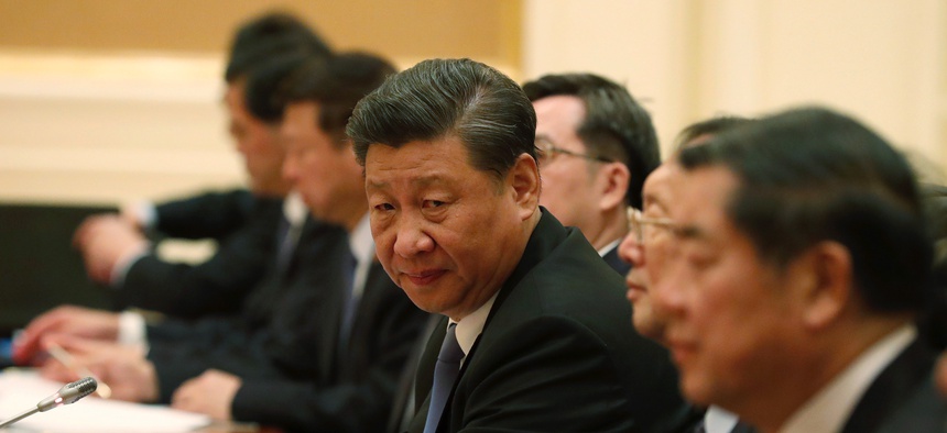 Chinese President Xi Jinping, center, attends the bilateral meeting with Myanmar State Counselor Aung San Suu Kyi, not in picture, at president house in Naypyitaw, Myanmar, Saturday, Jan. 18, 2020.
