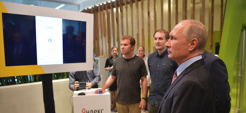 Russian President Vladimir Putin, right, visit Russia's largest internet search engine Yandex headquarters in Moscow, Russia, Thursday, Sept. 21, 2017