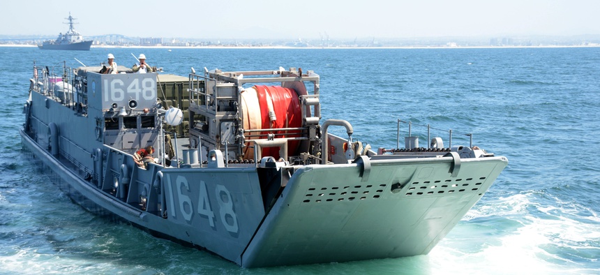 Landing Craft, Utility (LCU) 1648, attached to Assault Craft Unit (ACU) 1, prepares to enter the well deck of the dock landing ship USS Comstock (LSD 45).