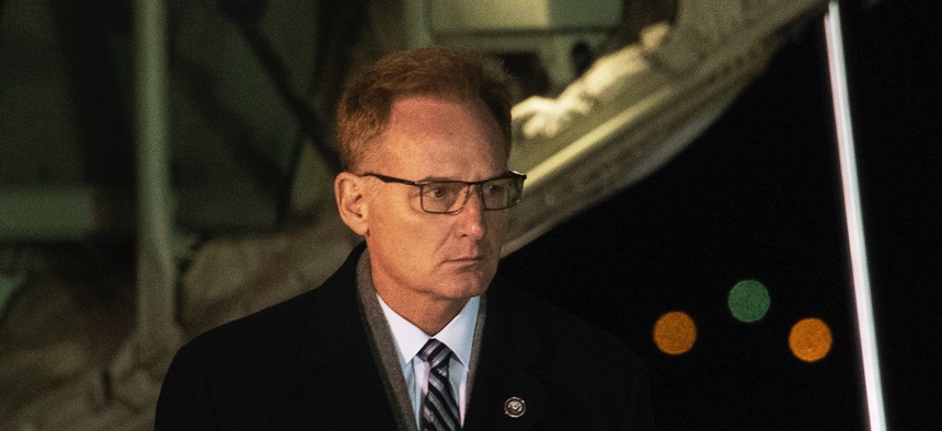 Acting Navy Secretary Thomas Modly, left, and Navy Adm. Michael Gilday, Chief of Naval Operations, Sunday, Dec. 8, 2019, at Dover Air Force Base, Del.