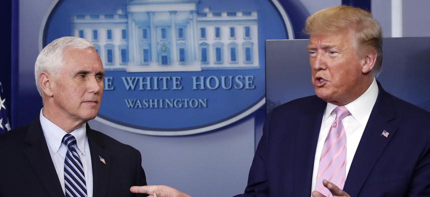 President Donald Trump speaks about the coronavirus in the James Brady Press Briefing Room of the White House, Wednesday, April 1, 2020, in Washington, as Vice President Mike Pence listens. Trump's diverging viewpoints on the coronavirus and China.