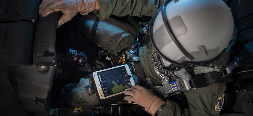 Maj. Earl Arnold, 12th Flying Training Wing electronic flight bag program manager, does preflight checks on a T-6 Texan using an electronic flight bag Feb. 13, 2018, at Joint Base San Antonio-Randolph.