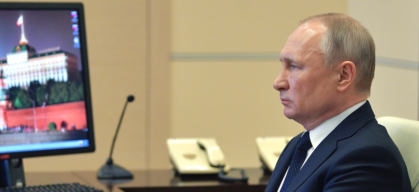 Russian President Vladimir Putin attend a meeting via video conference with heads of local governments at the Novo-Ogaryovo residence outside Moscow, Russia, Wednesday, April 8, 2020.