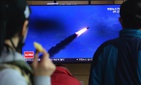 People watches a televsion screen showing a file image of North Korea's missile launch during a news program at the Seoul Railway Station in Seoul, South Korea, Saturday, March 21, 2020. People watches a televsion screen showing a file image of North Korea's missile launch during a news program at the Seoul Railway Station in Seoul, South Korea, Saturday, March 21, 2020.