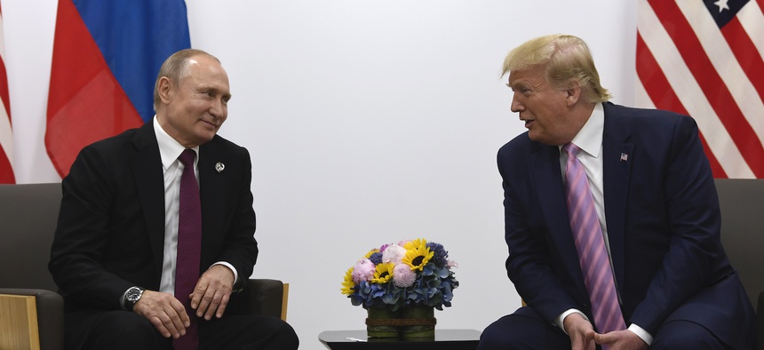 In this June 28, 2019, file photo, President Donald Trump, right, meets with Russian President Vladimir Putin during a bilateral meeting on the sidelines of the G-20 summit in Osaka, Japan.