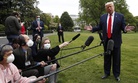 President Donald Trump speaks with reporters on the South Lawn of the White House as he departs on Marine One, Thursday, May 14, 2020, in Washington. 